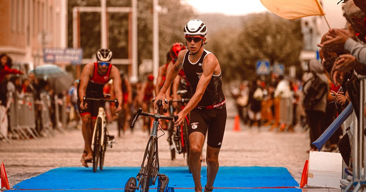 Triathletes in action at the transition area during a competitive event, showcasing athleticism and determination.