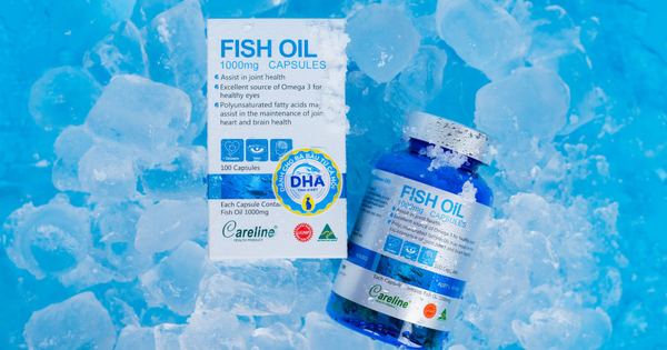 Fish oil capsules and packaging on ice, highlighting Omega 3 benefits for health.